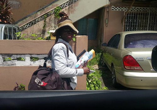 Tunapuna best PostLady and M.P. delivering Mail