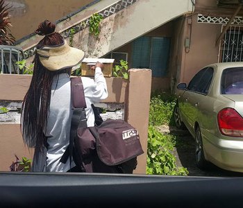 Tunapuna best PostLady and M.P. delivering Mail