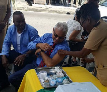 FLU Shots at Tunapuna Market with Minister of Health Terrence Deyalsingh.