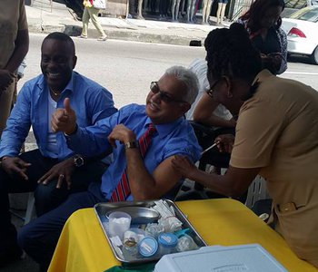 FLU Shots at Tunapuna Market with Minister of Health Terrence Deyalsingh.