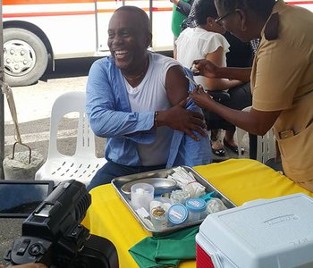 FLU Shots at Tunapuna Market with Minister of Health Terrence Deyalsingh.