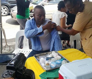 FLU Shots at Tunapuna Market with Minister of Health Terrence Deyalsingh.