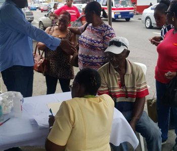 FLU Shots at Tunapuna Market with Minister of Health Terrence Deyalsingh.